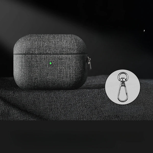 Cloth grain AirPods case in dark fabric texture with green indicator light