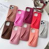 Rhode Ribbon silicone case in pink shade with MagSafe ring on iPhone.