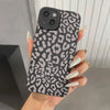 Black leopard print case with matte texture held in hand