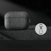 Cloth grain AirPods case in dark fabric texture with green indicator light