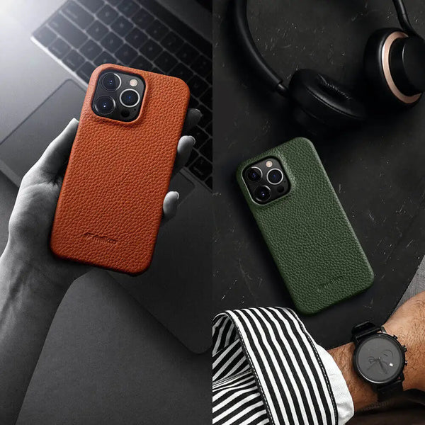 IPhone with leather case beside desk setup